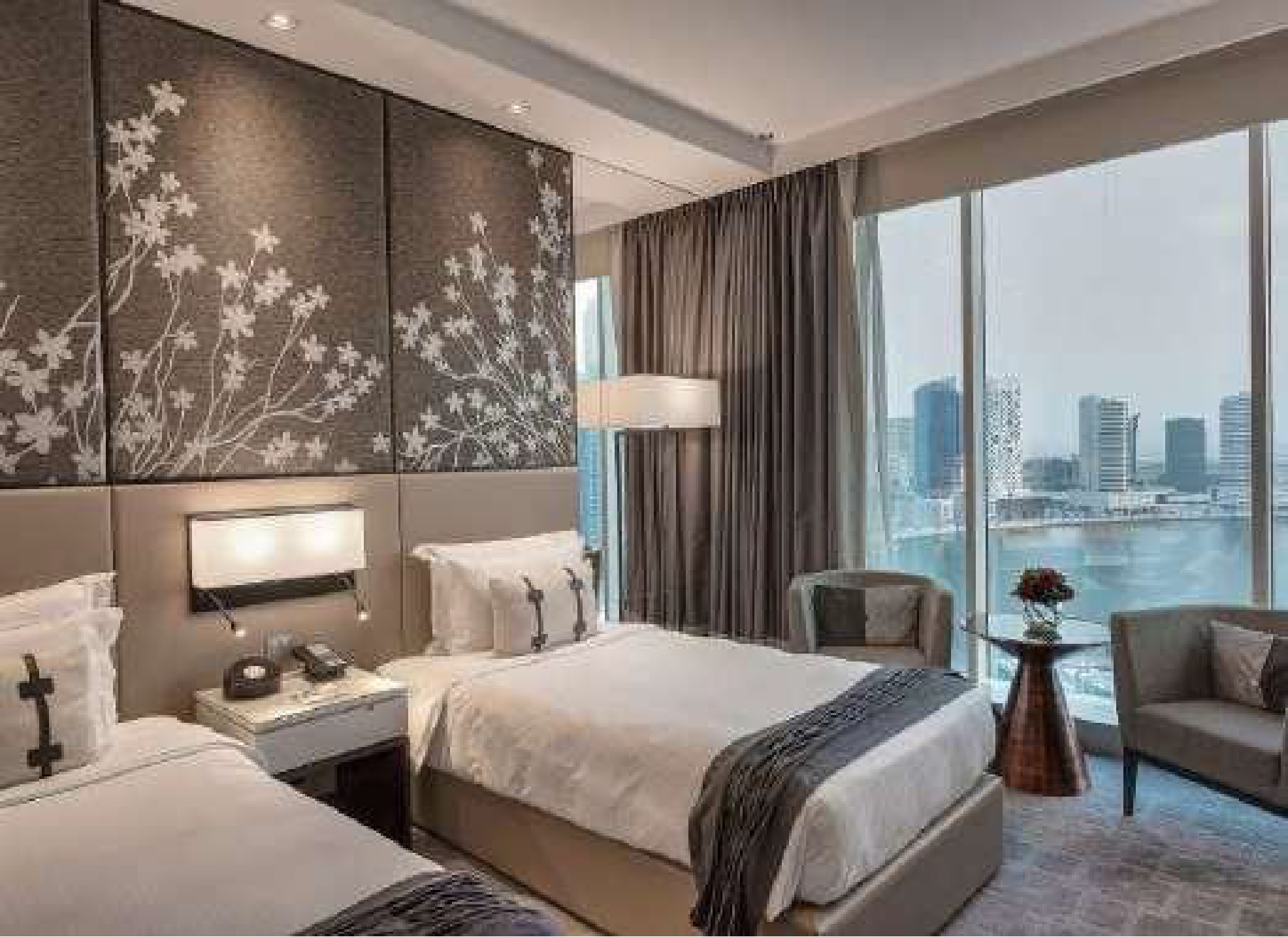 Hotel bedroom with refined warm finishes